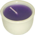 Set of 6 purple candles in white ceramic dish