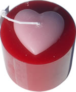 Round red pillar candle with pink heart top 