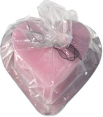 Pink heart candle on metal heart tray 