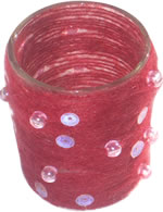 Glass tealight cup with red thread and sequins