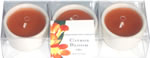 Set of 3 orange candles in white ceramic cup, boxed 